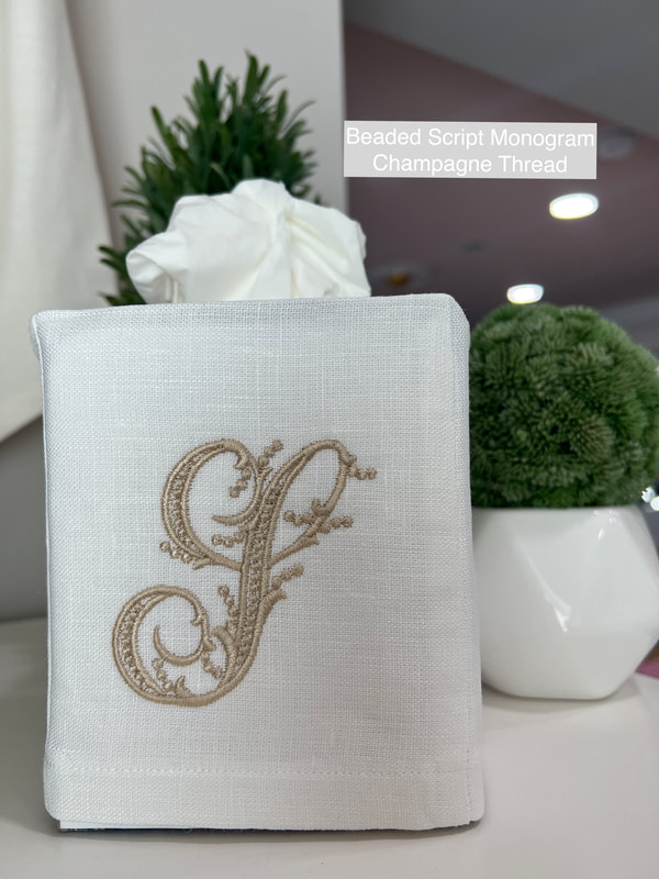 White Linen Tissue Cover with Beaded script letter S in Champagne Thread.